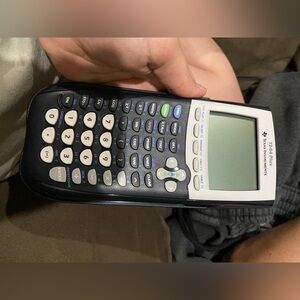 TI-84 Graphing Calculator with Black and White Design